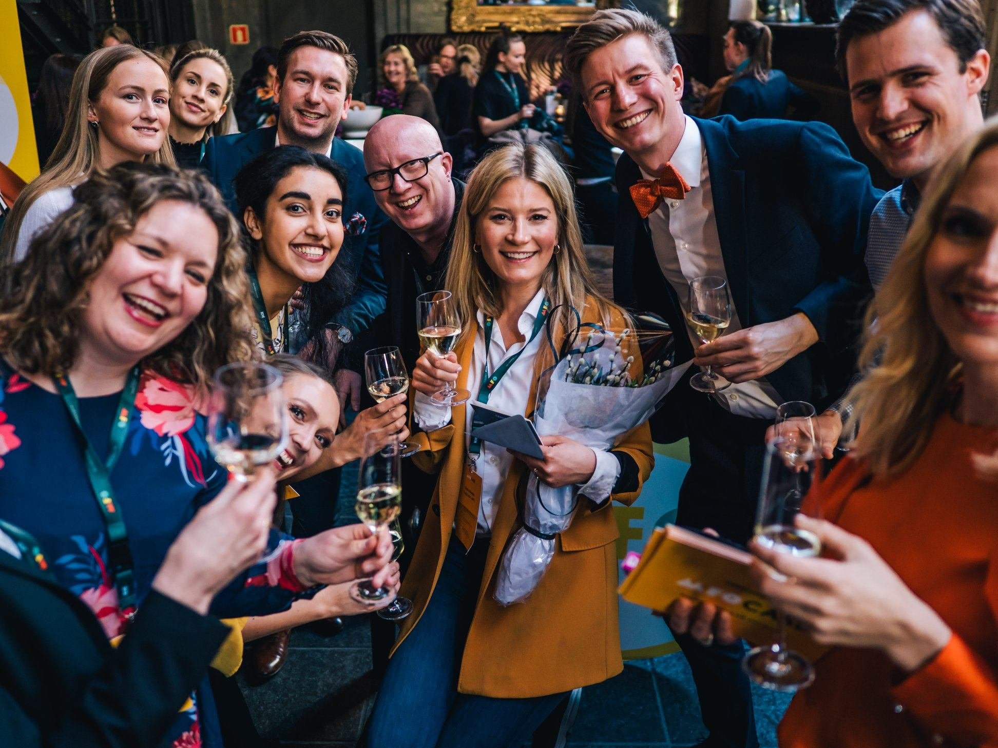People smiling at the camera on a event